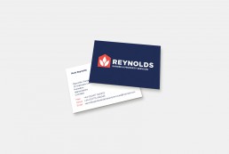 Reynolds garden and property services logo and business card design, photographed on an off white background