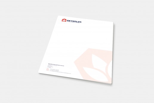 Reynolds garden and property services logo and letterhead design, photographed on an off white background
