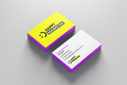 Bright yellow and purple happy marketer business cards with smiley face icon created by branding agency DBC Creative Agency