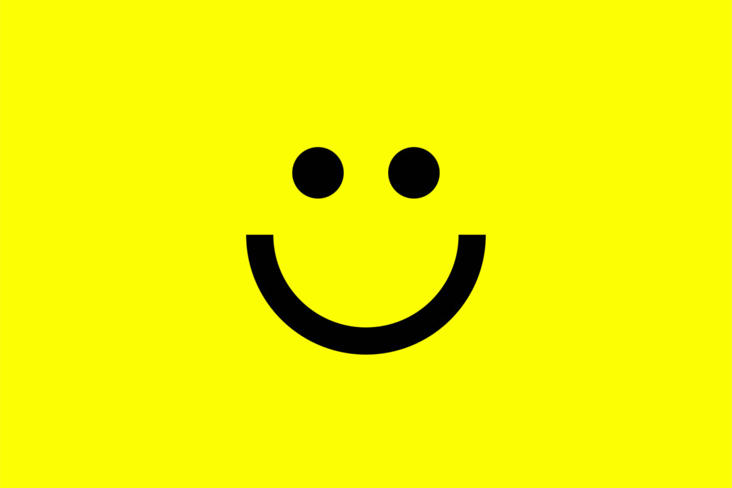 Happy Marketer smiley face icon in black on a yellow background created by branding agency DBC Creative Agency