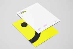 Happy Marketer yellow and black letterhead with a smiley face, created by branding agency DBC Creative Agency